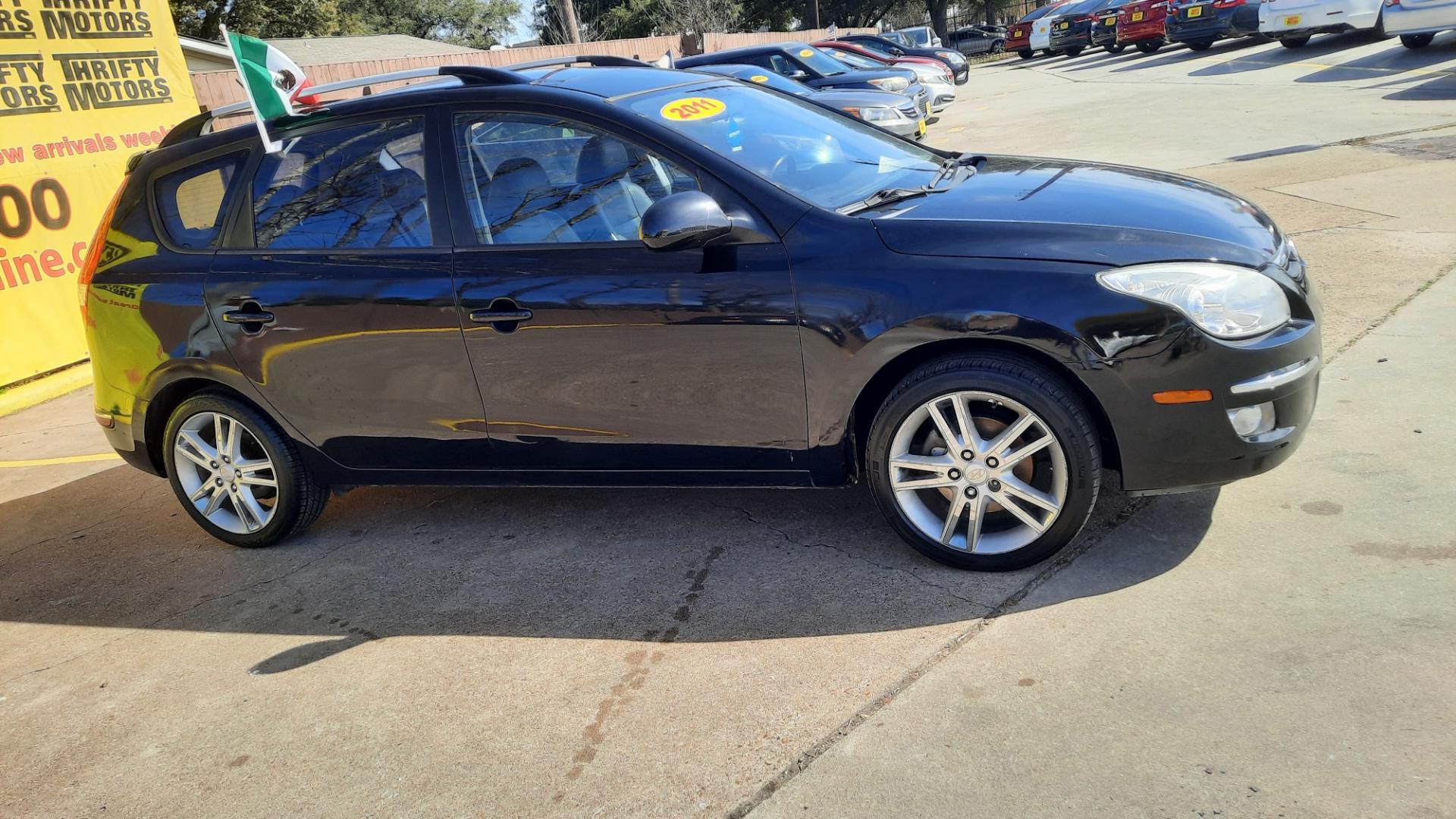 2011 Hyundai Elantra Touring (KMHDC8AE4BU) , located at 16710 Clay Rd., Houston, TX, 77084, (281) 859-7900, 29.834864, -95.656166 - Photo#2